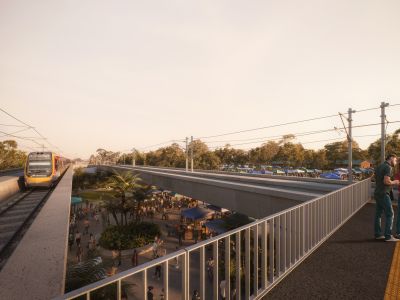 Artist impression of people standing on the new elevated platform at Woodridge station, waiting to catch a train approaching on the new elevated rail line.